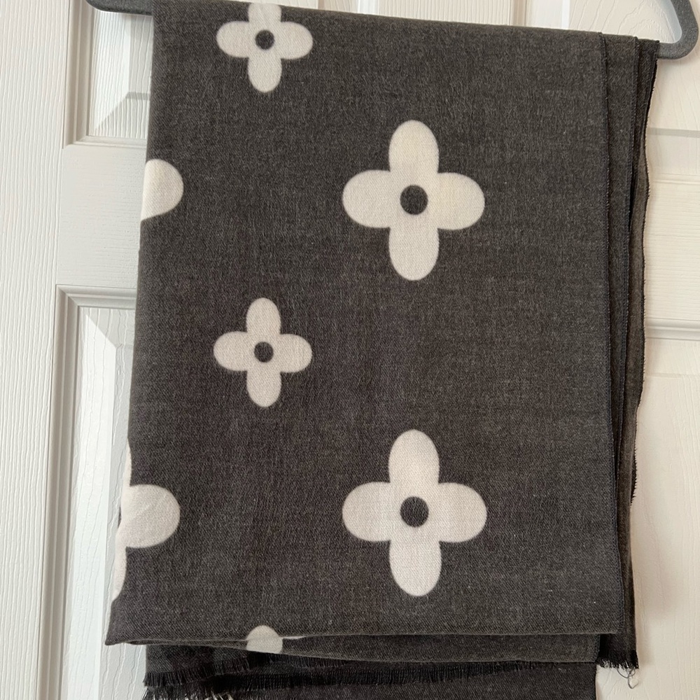 Dark gray winter scarf with white flowers.